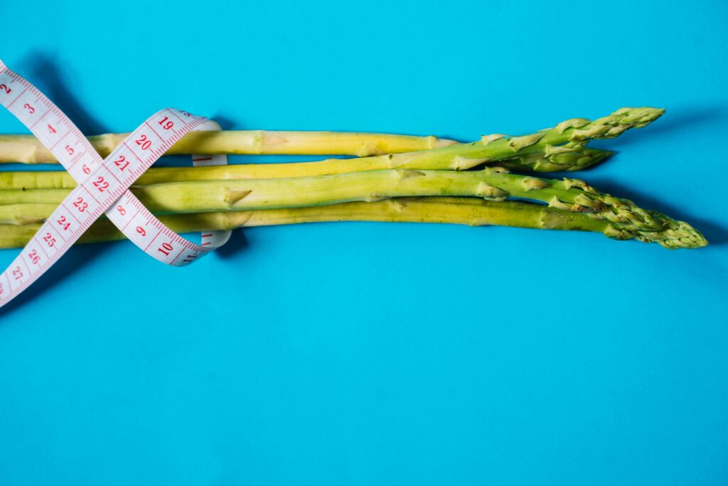 Colorful weight loss meal prep containers with healthy balanced meals arranged on kitchen counter